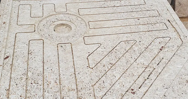 Particleboard panel with routed channels and grooves