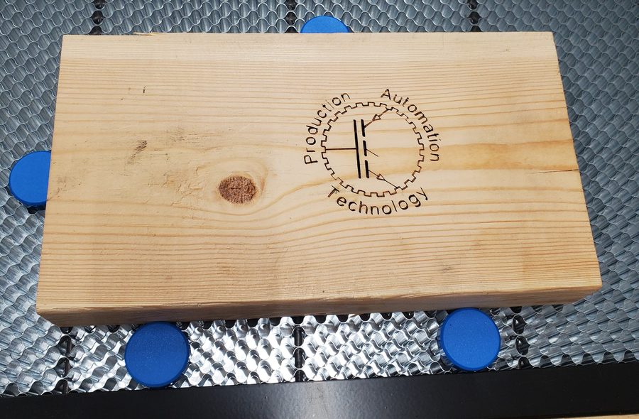 Laser-engraved logo on a wood part