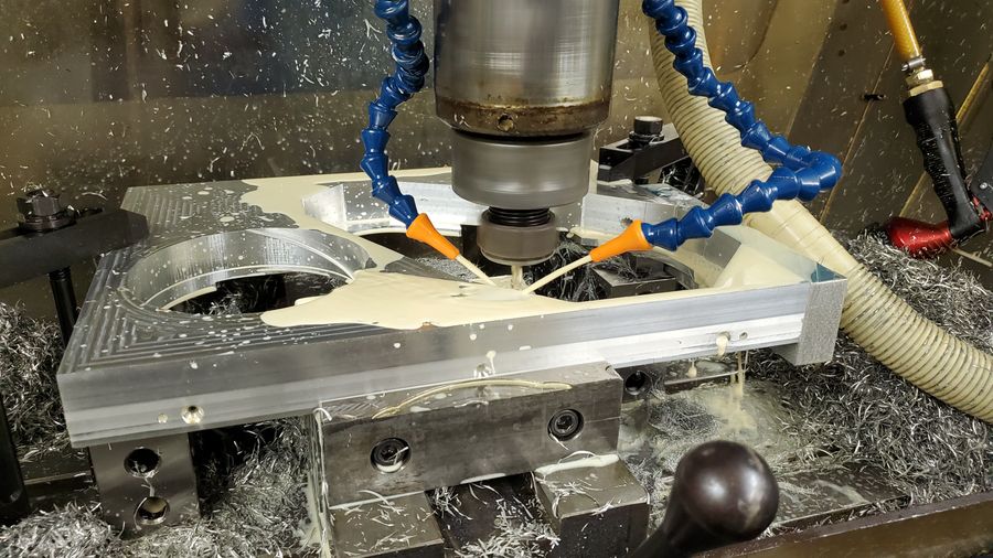 Milling an aluminum part with holes on the edge